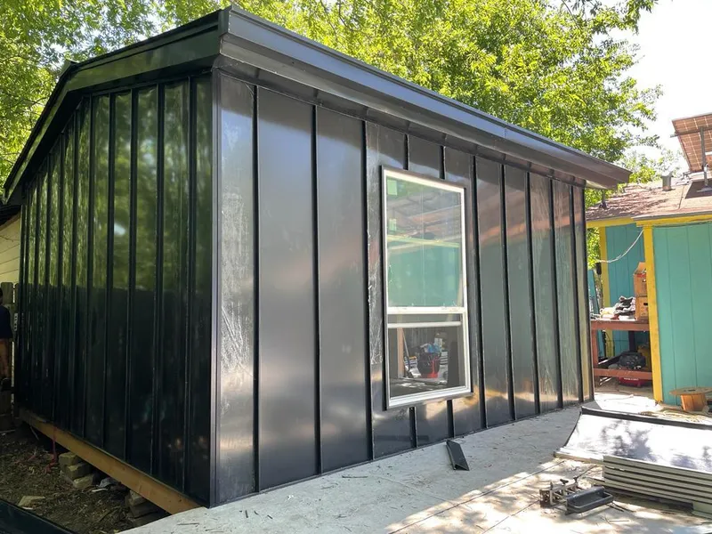 Black standing seam metal wall panels for Roof Inspection in Salina